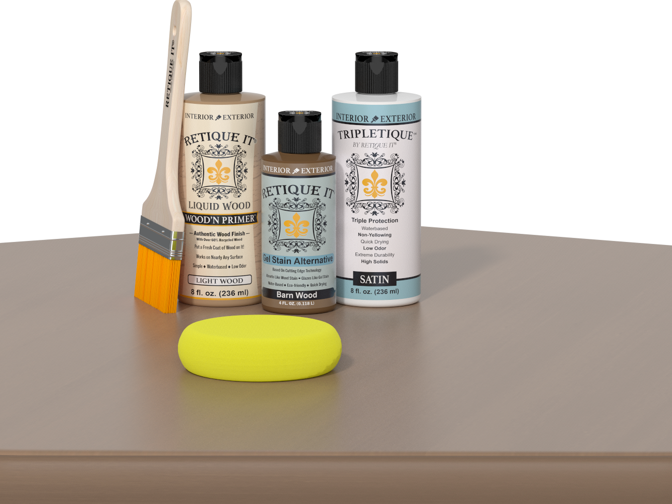 Retique It Barn Wood Kit displayed on a tabletop with the Light Wood Liquid Wood Wood'n Primer bottle, Barn Wood Gel Stain Alternative bottle, and Satin Tripletique topcoat bottle arranged together. A natural wood-handled paintbrush stands beside the products, and a yellow sponge rests in front of the bottles. The product labels face forward against a simple dark background.