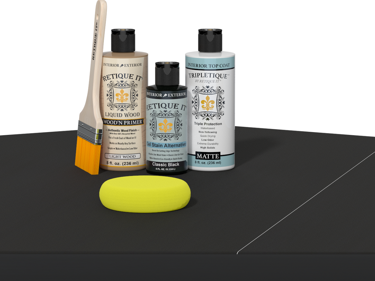 Retique It® Light Wood Wood’n Primer with Classic Black Gel Stain Alternative, matte topcoat, brush, and yellow sponge on a dark tabletop.