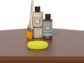 Retique It® Light Wood Wood’n Primer with Cherry Gel Stain Alternative, brush, and yellow sponge on a brown tabletop.