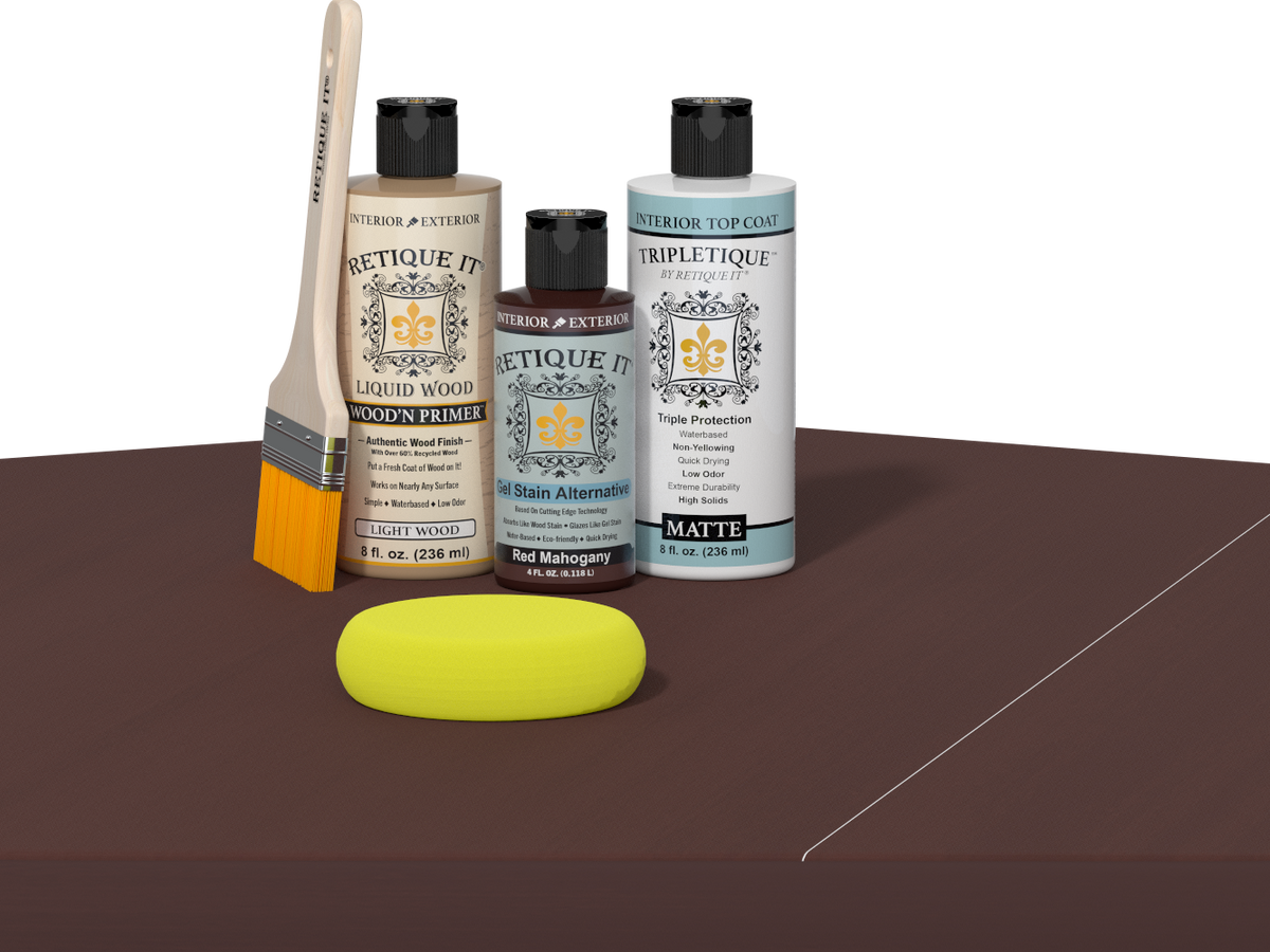 Retique It® Light Wood Wood’n Primer with Red Mahogany Gel Stain Alternative, matte topcoat, brush, and yellow sponge on a dark tabletop.