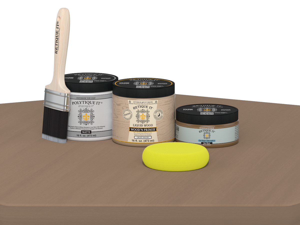Collection of paint-related products including a brush, jars, and a sponge on a brown surface.