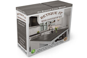 Retique It® Harbor Gray countertop kit box with stained kitchen island countertop showing wood grain finish.