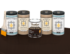 64 oz Retique It Liquid Wood kit with Kona stain, gloss Tripletique topcoat, and a paintbrush on a matching finished tabletop.