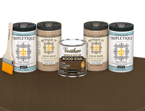 64 oz Retique It Liquid Wood kit with Briarsmoke stain, matte Tripletique topcoat, and a paintbrush on a matching finished tabletop.