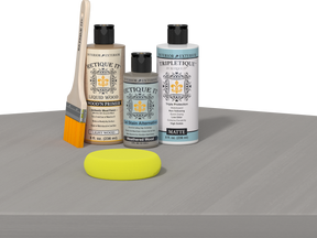 Retique It® wood finish kit in weathered wood for interior projects, featuring smooth top coat application on a table.