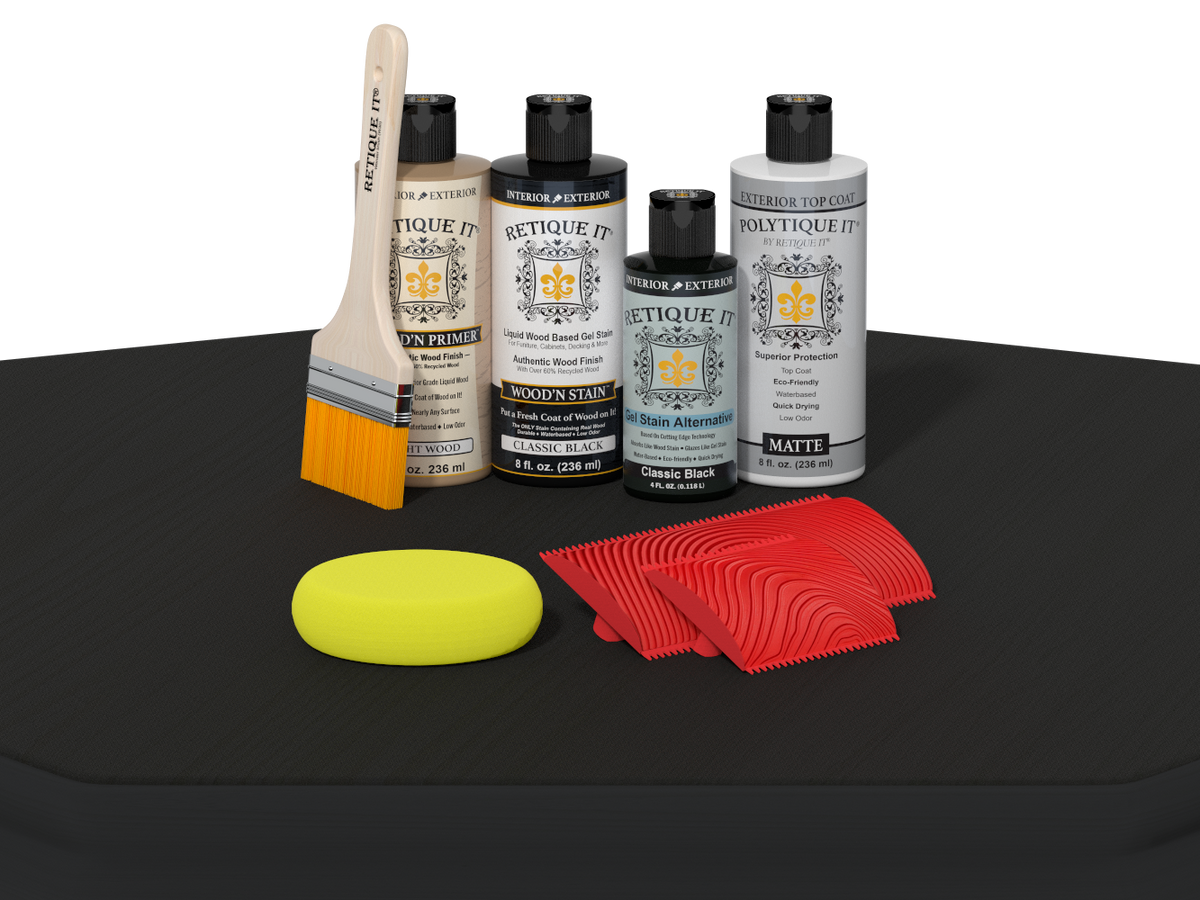 Set of automotive care products including bottles, a brush, and cloths on a black surface.