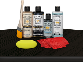 Retique It® Classic Black Wood'n Kit with Light Wood primer, Classic Black stain, Classic Black gel stain alternative, Gloss Tripletique® Top Coat, brush, red graining tool, and yellow sponge.