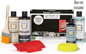 Retique It® Classic Black Multipurpose Kit with Light Wood primer, Classic Black stain, Classic Black gel stain alternative, Matte Tripletique® Top Coat, brush, red graining tool, yellow sponge, and product box.