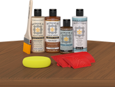 Retique It® Wood'n Finish Kit in Cedar stain displayed on a tabletop, showcasing natural wood finish and stain application.