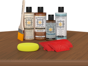 Retique It® Cedar Wood'n Kit with Gloss TripleTique® includes a brush, Light Wood primer, Cedar stain, Pecan Gel Stain Alternative, Gloss TripleTique® top coat, a yellow sponge, and a red graining tool.