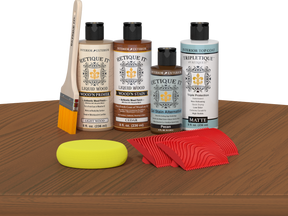 Retique It® Cedar Wood'n Kit with Light Wood primer, Cedar stain, Pecan gel stain alternative, Matte Tripletique® Top Coat, brush, red graining tool, and yellow sponge.