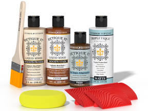 Retique It® Cedar Wood'n Kit with Light Wood primer, Cedar stain, Pecan gel stain alternative, Matte Tripletique® Top Coat, brush, red graining tool, and yellow sponge.