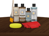 Retique It® Dark Oak Wood'n Kit with Light Wood primer, Dark Oak stain, Dark Oak gel stain alternative, Matte Tripletique® Top Coat, brush, red graining tool, and yellow sponge.