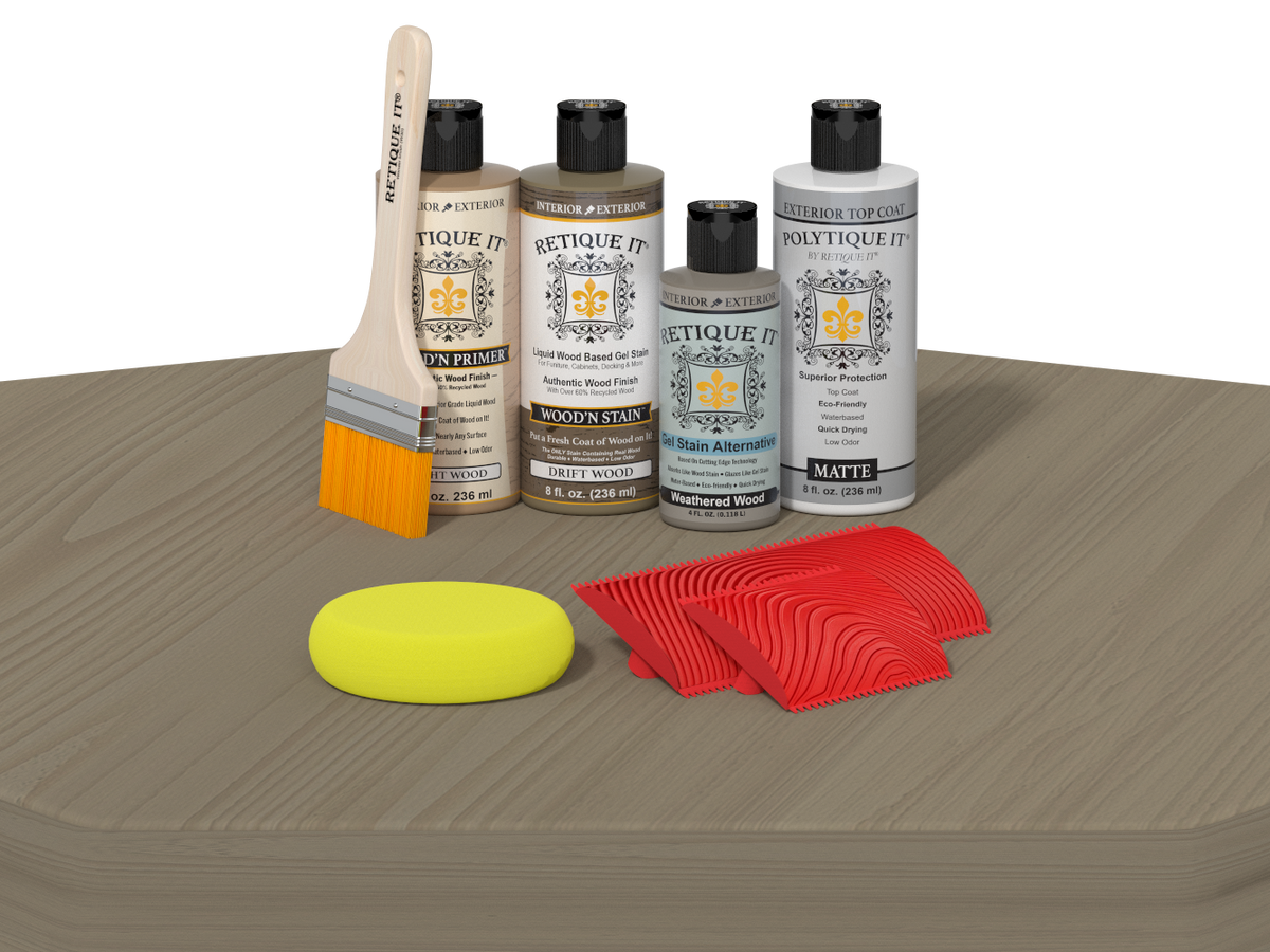 Set of automotive care products including bottles, a brush, a foam pad, and cloths on a gray surface.