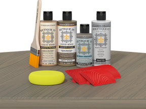 Retique It® Wood'n Finish Kit in Drift Wood with exterior top coat, displayed on a table for multi-purpose wood finishing.