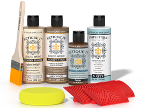 Retique It® Barn Wood Wood'n Kit with Light Wood Primer, Barn Wood Wood'n Stain, Matte TripleTique Top Coat, Pecan Gel Stain Alternative, yellow sponge, red graining tool, and brush.