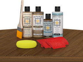 Retique It® Medium Walnut Wood'n Kit with Light Wood primer, Barn Wood stain, Pecan gel stain alternative, Satin Tripletique® Top Coat, brush, red graining tool, and yellow sponge.
