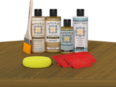 Retique It® Wood'n Finish Kit in Old Oak stain displayed on a table, showing the stain application for wood finishing.