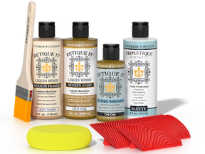 Retique It® Old Oak Wood'n Kit with Light Wood primer, Old Oak stain, Old Oak gel stain alternative, Matte Tripletique® Top Coat, brush, red graining tool, and yellow sponge.
