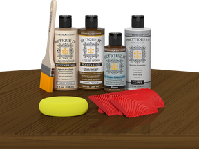 Retique ItÂ® Wood'n Finish Kit in Dark Pecan, exterior top coat with wood finish and application tools on a table.