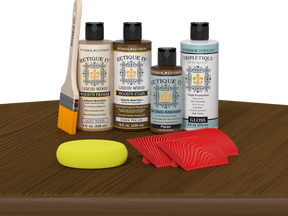 Retique It® Dark Pecan Wood'n Kit with Light Wood primer, Dark Pecan stain, Pecan gel stain alternative, Gloss Tripletique® Top Coat, brush, red graining tool, and yellow sponge.