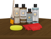 Retique It® Dark Pecan Wood'n Kit with Light Wood primer, Dark Pecan stain, Pecan gel stain alternative, Matte Tripletique® Top Coat, brush, red graining tool, and yellow sponge.