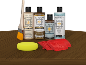 Retique It® Dark Pecan Wood'n Kit with Light Wood primer, Dark Pecan stain, Pecan gel stain alternative, Matte Tripletique® Top Coat, brush, red graining tool, and yellow sponge.