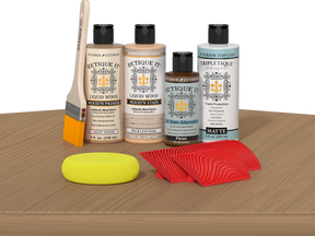 Retique It® Pickled Oak Wood'n Kit with Light Wood Primer, Pickled Oak Wood'n Stain, Matte TripleTique Top Coat, Pecan Gel Stain Alternative, yellow sponge, red graining tool, and brush.
