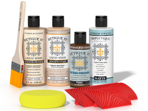 Retique It® Pickled Oak Wood'n Kit with Light Wood Primer, Pickled Oak Wood'n Stain, Matte TripleTique Top Coat, Pecan Gel Stain Alternative, yellow sponge, red graining tool, and brush.