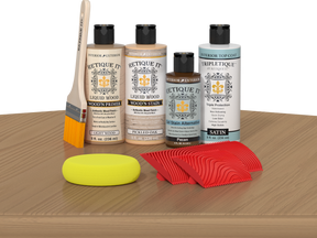 Retique It® Pickled Oak Wood'n Kit with Light Wood primer, Pickled Oak stain, Pecan gel stain alternative, Satin Tripletique® Top Coat, brush, red graining tool, and yellow sponge.