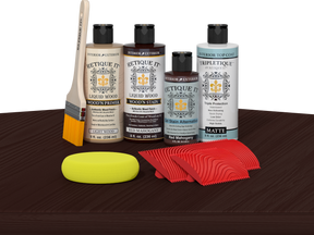 Retique It® Red Mahogany Wood'n Kit with Light Wood primer, Red Mahogany stain, Red Mahogany gel stain alternative, Matte Tripletique® Top Coat, brush, red graining tool, and yellow sponge.