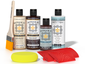 Retique It® Red Mahogany Wood'n Kit with Light Wood primer, Red Mahogany stain, Red Mahogany gel stain alternative, Matte Tripletique® Top Coat, brush, red graining tool, and yellow sponge.