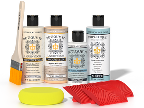 Retique It® Sunbleached Wood'n Kit with Bleached Wood Primer, Pickled Oak Wood'n Stain, Matte TripleTique Top Coat, White Wash Gel Stain Alternative, yellow sponge, red graining tool, and brush.