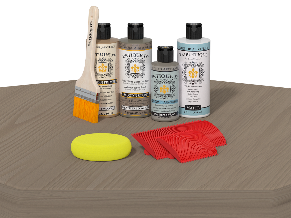 Set of wood staining products including bottles, a brush, and applicators on a wooden surface.