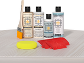Retique It® Wood'n Finish Kit in White Wash stain applied to a tabletop, showcasing the wood finish and color.