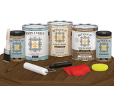 Retique It® Wood'n Finish Kit in Modern Walnut with matte topcoat, showing four large wood finishing bottles on a table.