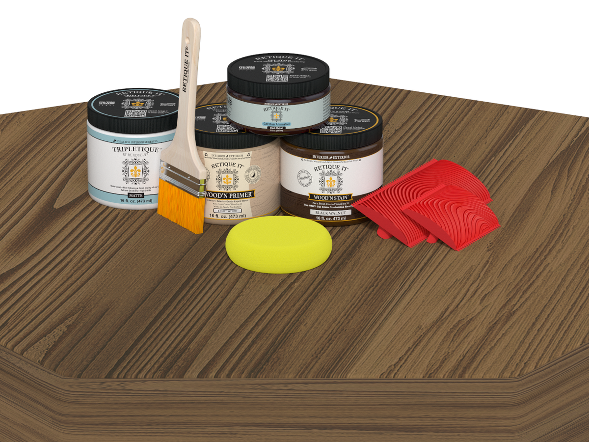 Woodworking kit with paint cans, brush, and sponges on a wooden surface