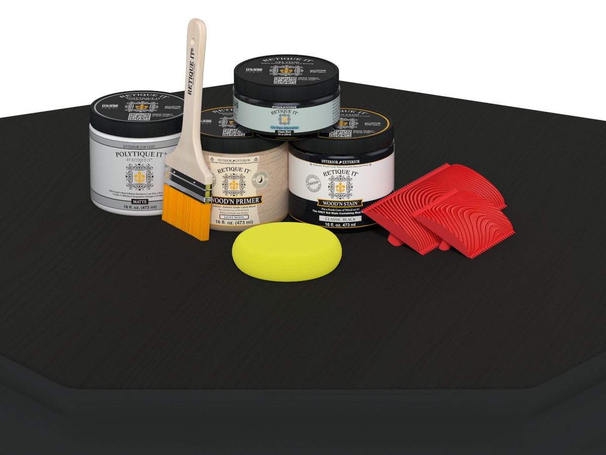 Collection of paint cans, brushes, and sponges on a black surface