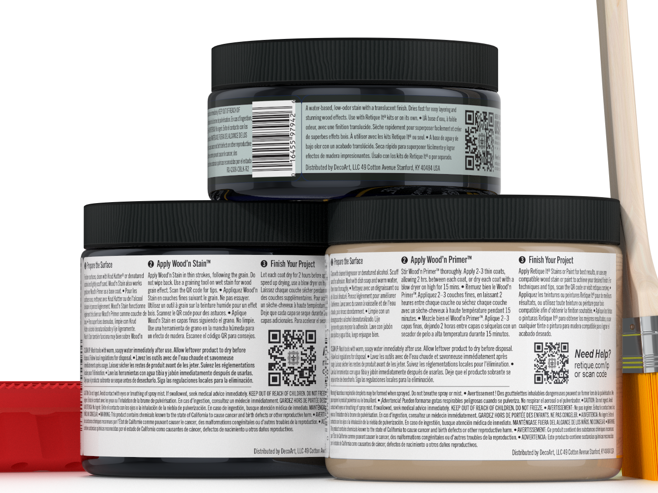 Three jars of wood finish product with labels and a brush on a white background