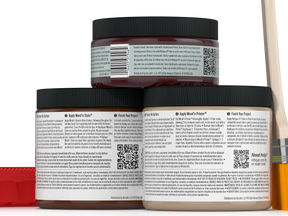 Three jars of wood finish product with labels and a paintbrush on a white background