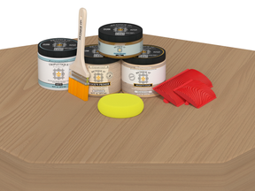Retique It® Wood'n Finish Kit in Pickled Oak for interior top coat, showing a table with wood finish application.