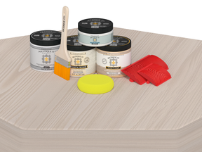 Paint cans and tools on a wooden surface