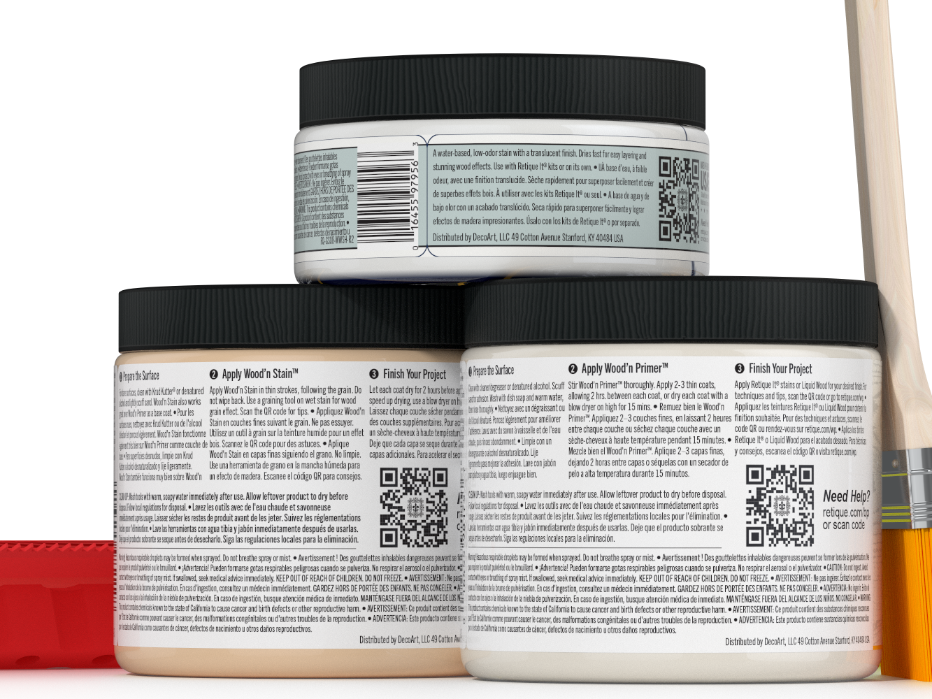 Three jars of wood finish product with labels and a brush on a white background