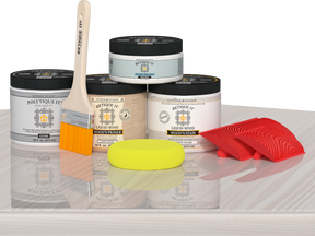 Retique It® Wood’n Kit in White Wash, multi-purpose exterior top coat kit displayed on table with brushes and wood sample.