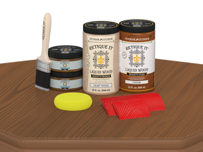 Retique It Wood'n Finish Front Door Kit for double cedar doors, including stain and finishing supplies, displayed on a table.