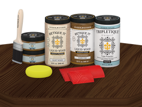 Retique It® Wood'n Cabinet Kit with 12 dark oak grained stained cabinet doors on a table surface.