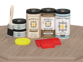 Retique It Wood'n Finish Kit with four large French Oak stain bottles for tabletop furniture, matte finish on a wooden surface.