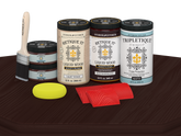 Retique It® Red Mahogany countertop stain kit for full kitchen, matte finish on a wooden surface.