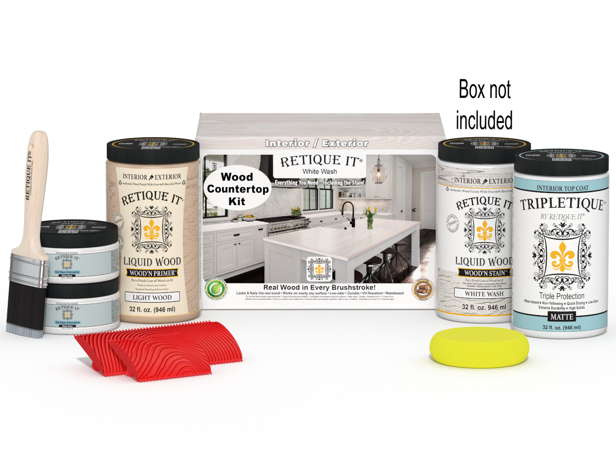 Retique It® White Wash countertop kit showing stained wood surface with full kitchen setup and packaging in the background.
