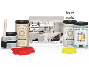 Retique It® White Wash countertop kit showing stained wood surface with full kitchen setup and packaging in the background.